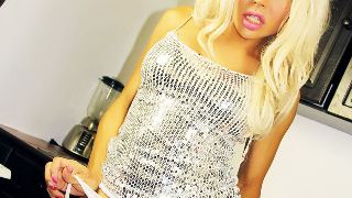 Blonde Shemale sitting on a long pink dildo